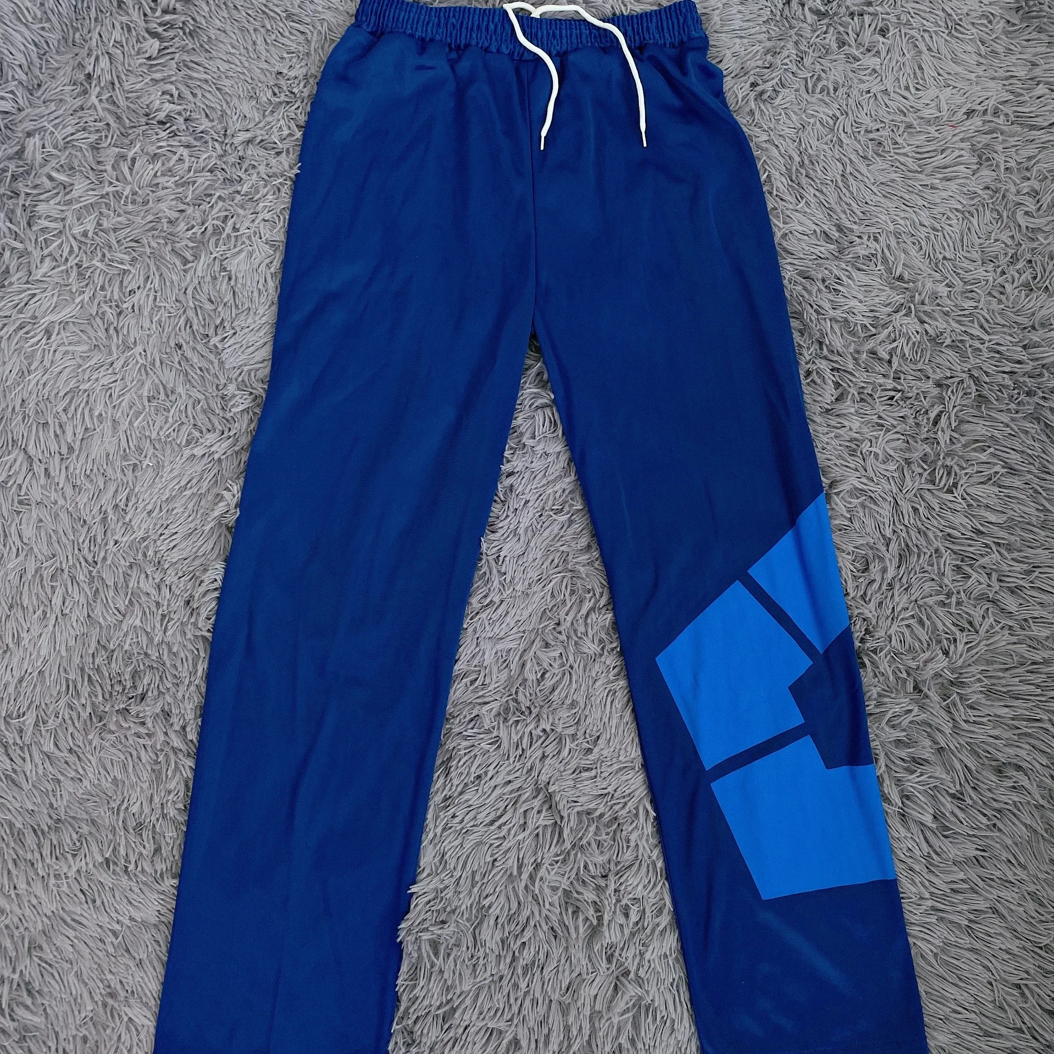 Calça azul-marinho do agasalho de Blue Lock, com cordão e recorte azul-claro na perna