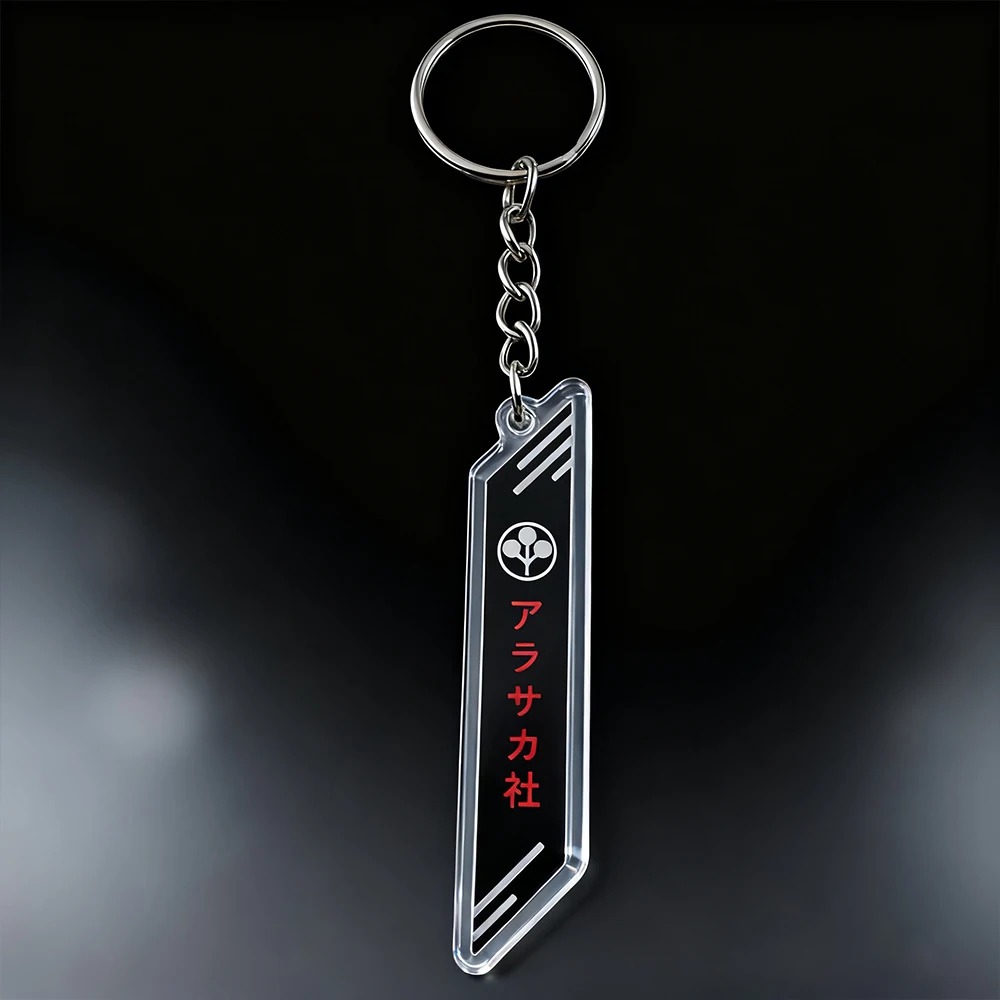 Chaveiro de acrílico com o logo da Arasaka, de Cyberpunk 2077, em preto e transparente, sobre fundo escuro