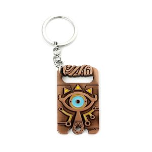 Chaveiro acobreado do Purah Pad de Zelda, com Olho Sheikah azul e argola prateada
