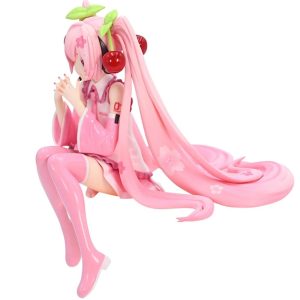 Figure da Hatsune Miku Sakura sentada, em rosa, com cerejas no cabelo e as madeixas longas ao redor