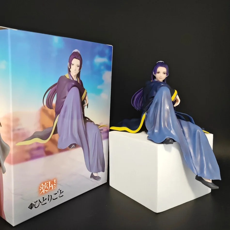 Figure do Jinshi sentado num bloco branco, ao lado da caixa colorida da série
