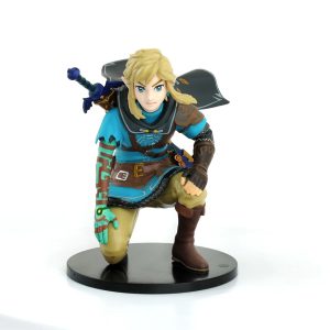 Link ajoelhado de túnica azul-turquesa e espada nas costas, figure de The Legend of Zelda, sobre base preta
