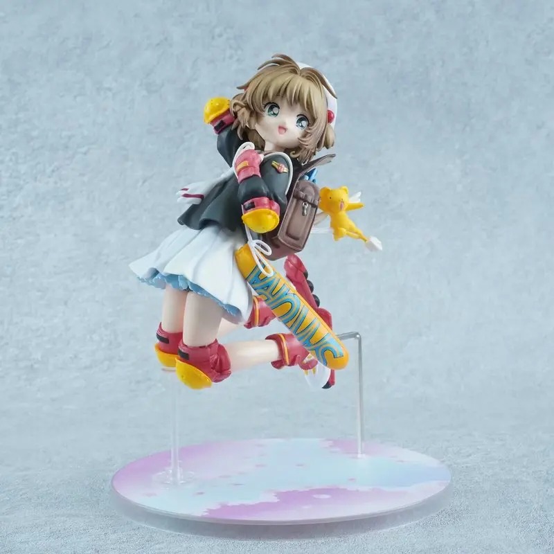Sakura Kinomoto, de Sakura Card Captors, em figure de patins, pulando sobre base colorida