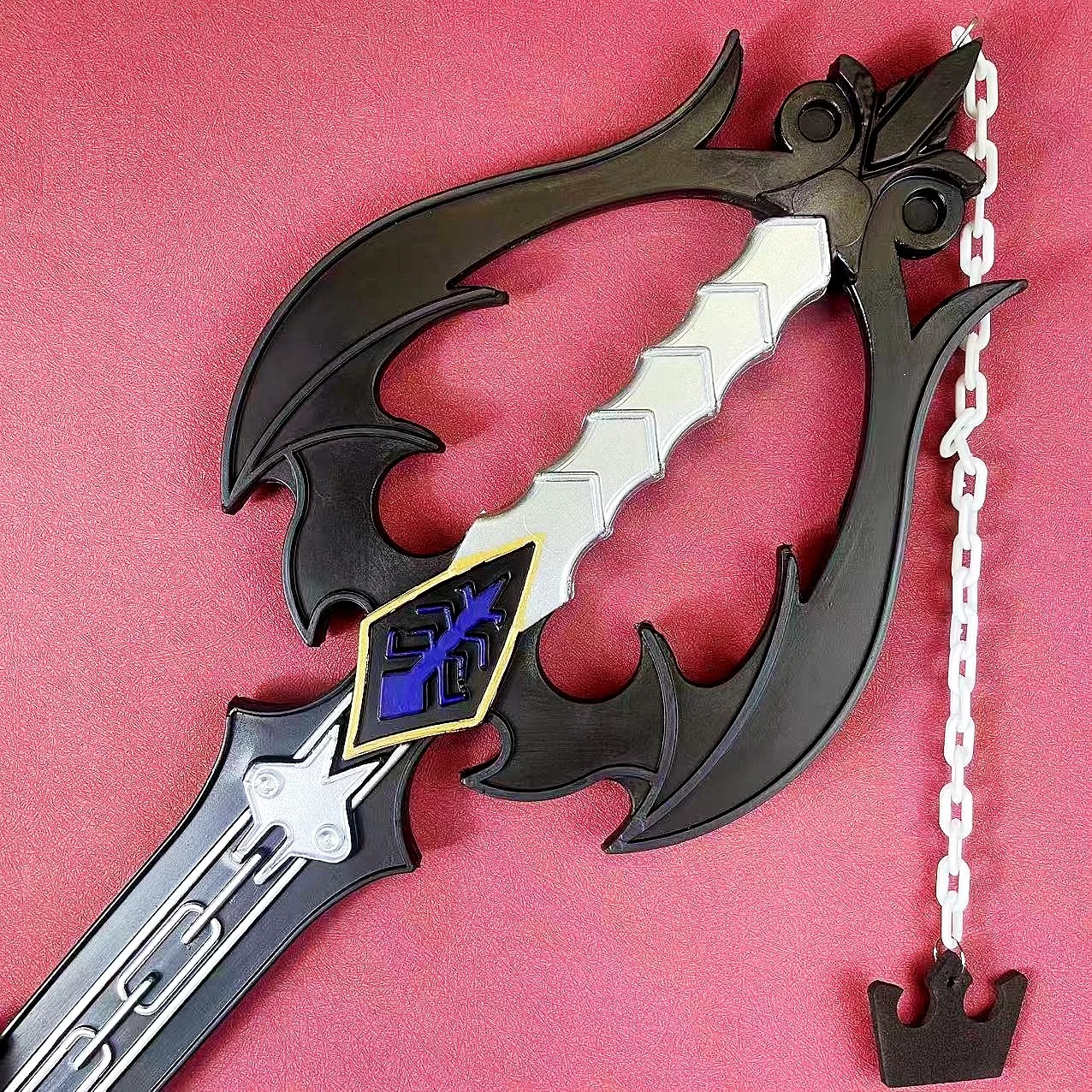Guarda e chaveiro em coroa da keyblade Oblivion de Kingdom Hearts