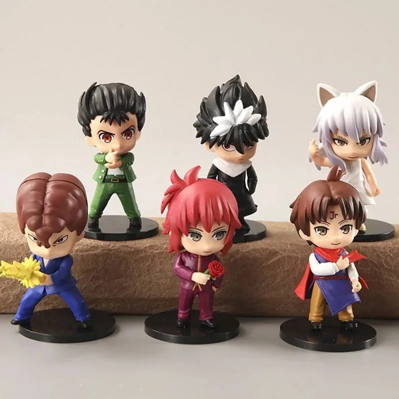Seis figures de Yu Yu Hakusho com base preta, fotografadas sobre uma pedra