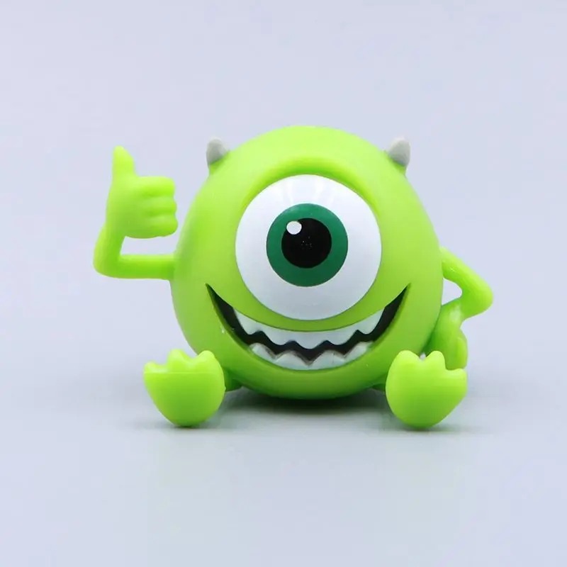 Mike Wazowski em figure Q, verde de um olho só, com o polegar para cima