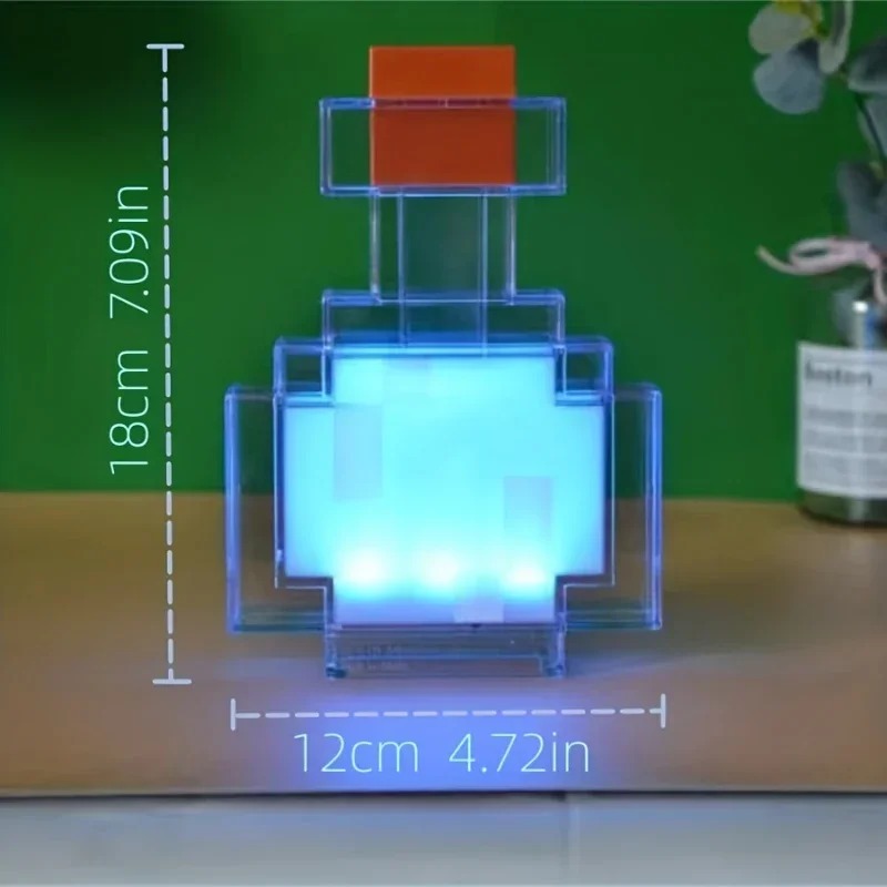 Luminária de poção do Minecraft acesa em azul, com a altura de 18 cm e a largura de 12 cm indicadas