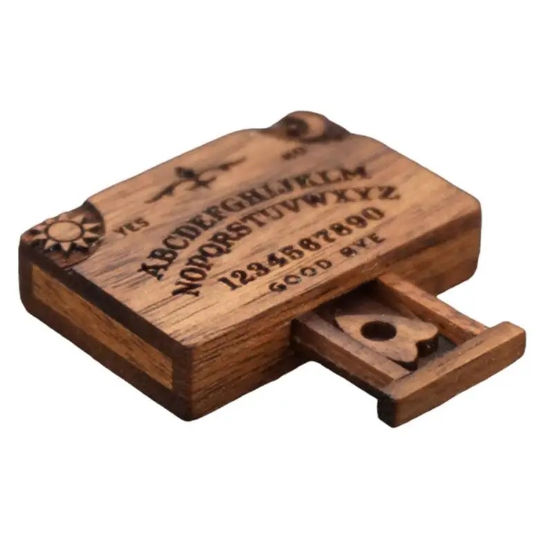 Mini tabuleiro Ouija de madeira com a gavetinha aberta e o ponteiro à mostra