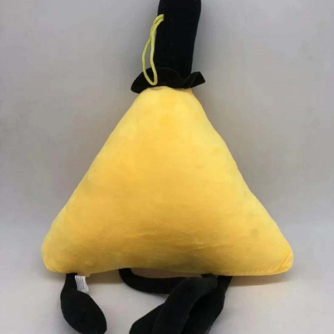 Parte de trás da pelúcia amarela do Bill Cipher, de Gravity Falls
