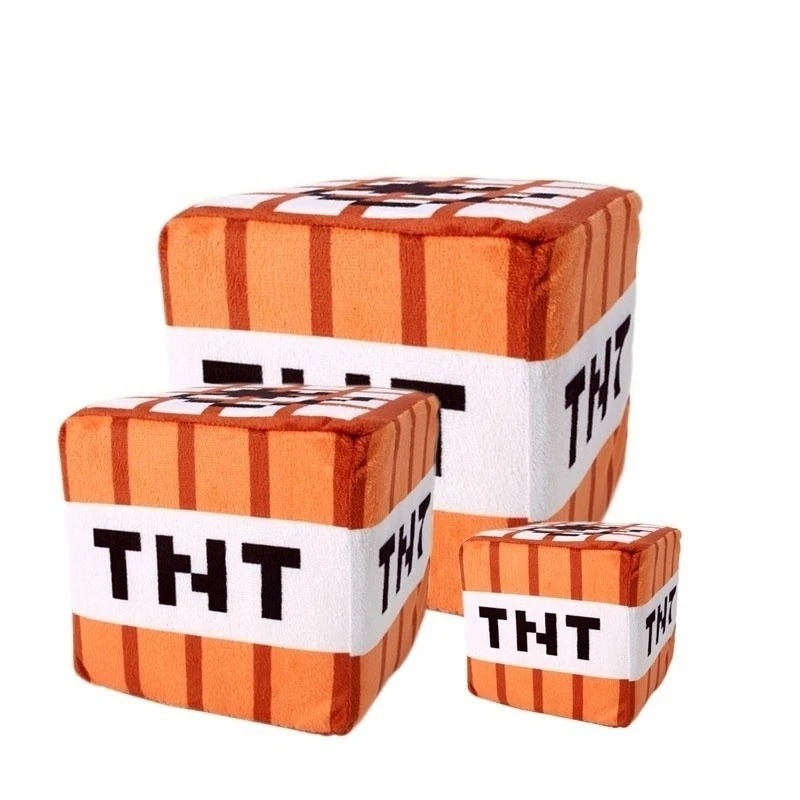 Três cubos de pelúcia de TNT de Minecraft em tamanhos diferentes