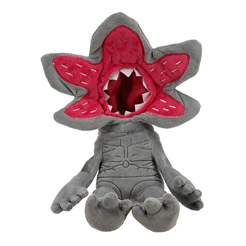 Demogorgon de Stranger Things em pelúcia cinza sentada, com a cabeça de pétalas vermelhas
