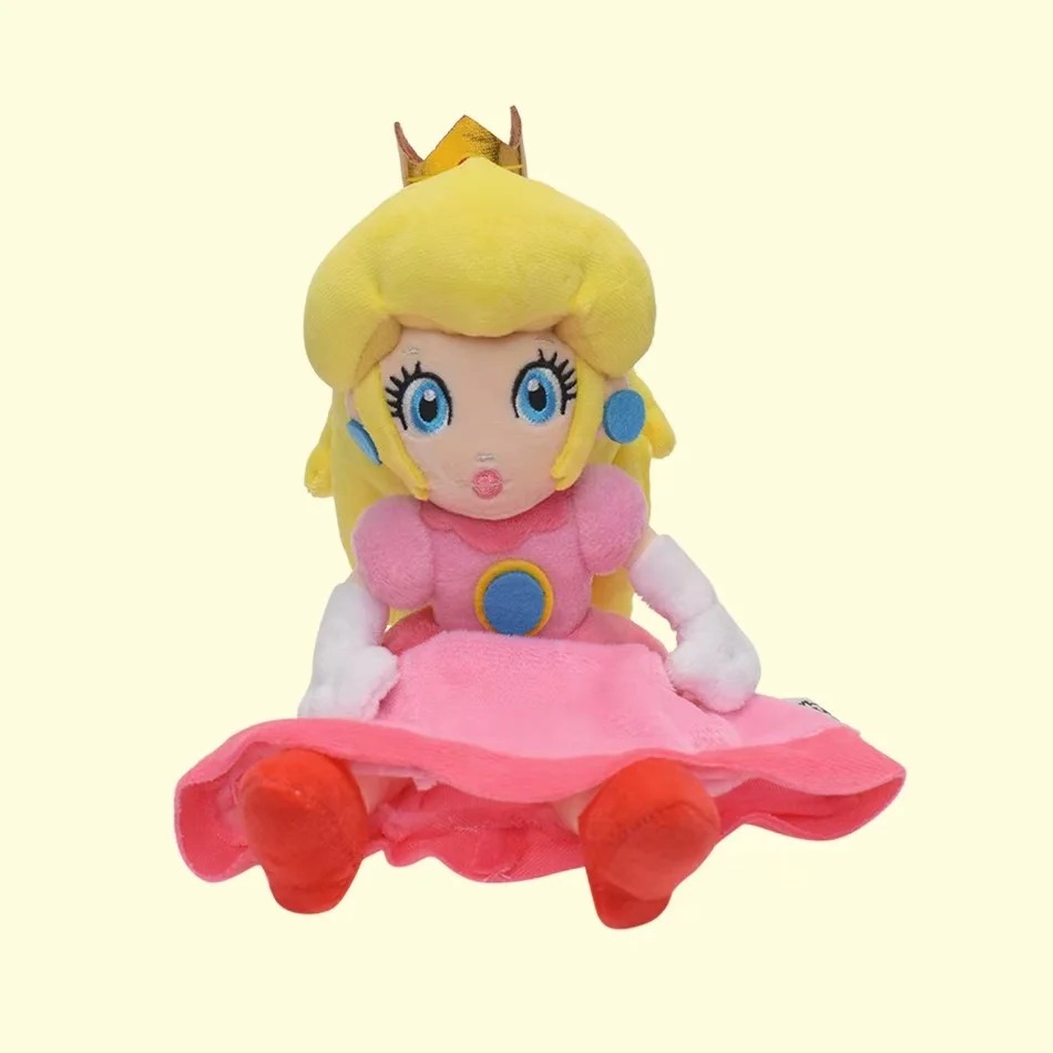 Pelúcia da Princesa Peach sentada, com o vestido rosa aberto