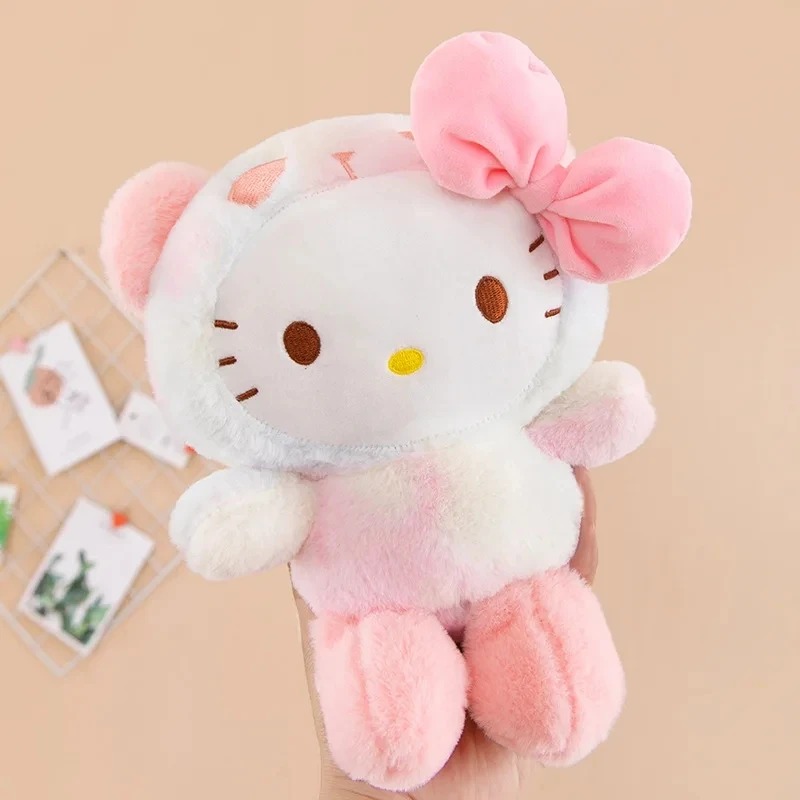 Pelúcia da Hello Kitty de ursinho rosa, com laço rosa