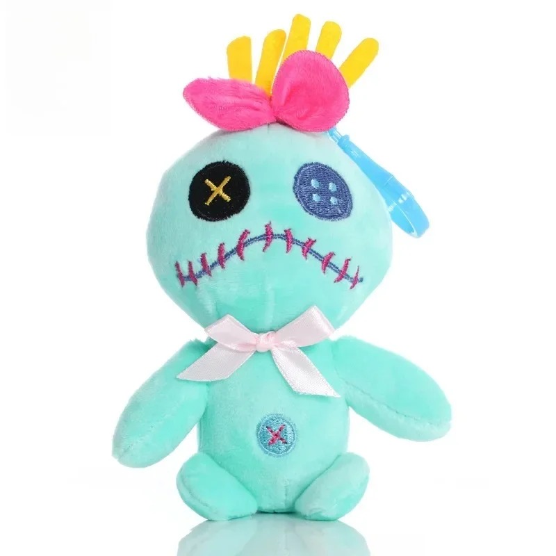 Pelúcia da Scrump de frente, com laço rosa e fita azul para pendurar