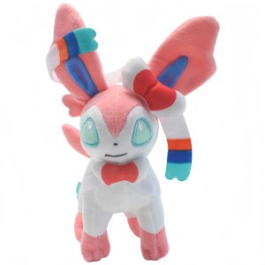 Sylveon de pelúcia, de Pokémon, com 15 cm, rosa e branco, fitas azuis, em pé sobre fundo branco