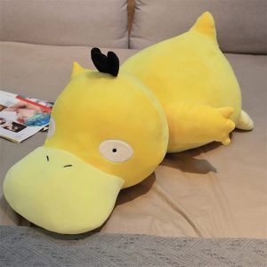 Pelúcia grande do Psyduck, de Pokémon, amarela e deitada