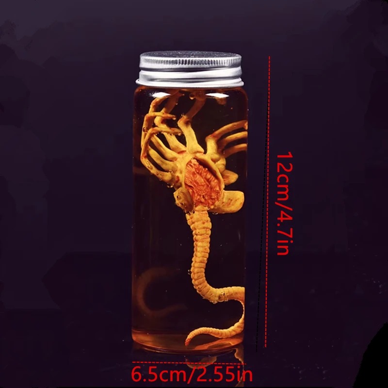 Frasco do facehugger com as medidas de 12 cm por 6,5 cm indicadas