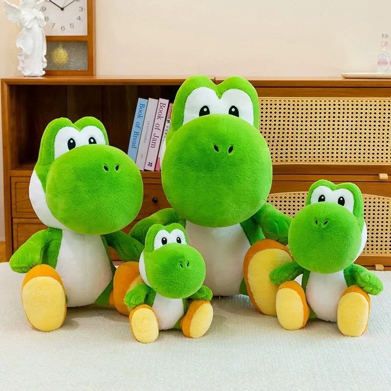 Yoshis de pelúcia enfileirados, do menor para o maior